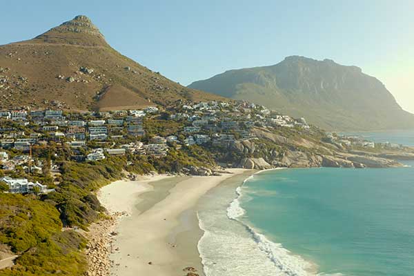 Clifton Fourth Beach in Cape Town with white sand, granite boulders and blue Atlantic water