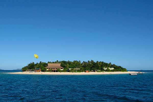 White sandy beach and clear water at Beachcomber Island Resort
