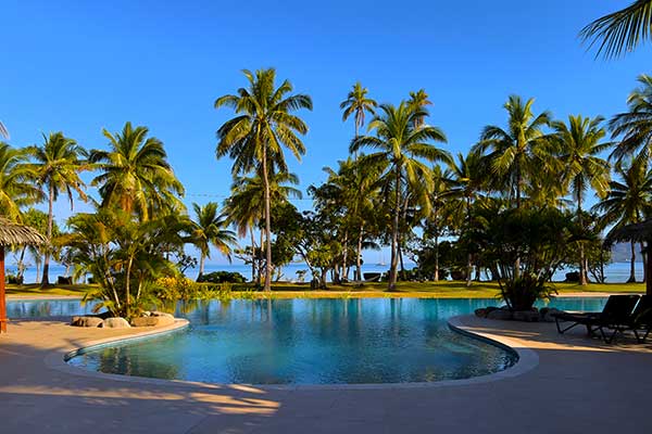 Beach and turquoise lagoon at Malolo Island in Fiji
