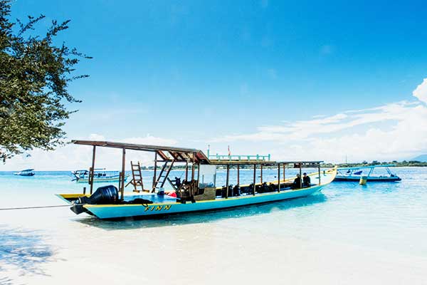 White sand beach with crystal clear turquoise water and no motor vehicles on a Gili Island, Indonesia